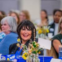 Audience member listening to speaker 3
